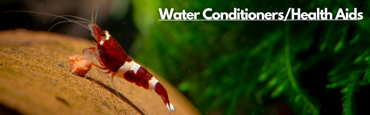 A red and white shrimp happily eating its food on a natural looking background with a label 'Water Conditioners/Health Aids' on the top right corner.